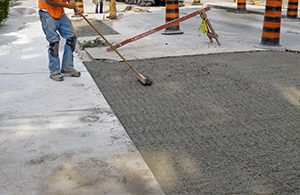 Worker repairing concrete in Kent, Washington